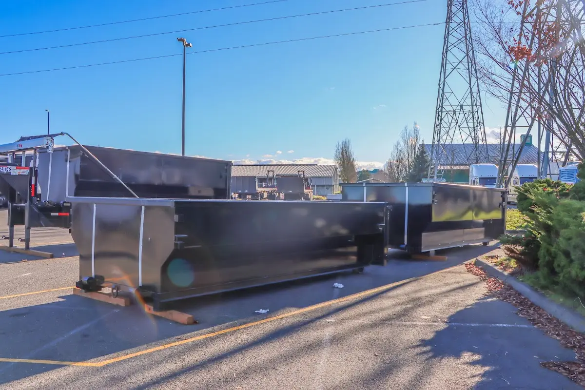 Roll-off dumpster ready for waste disposal at job site for 12 Yard Dumpster Rental in Opelika